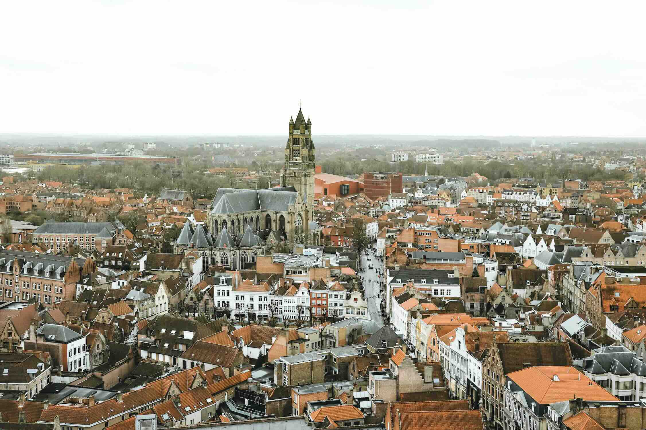 The medieval belfry and stepped-gable guild houses on the Markt in the historic centre of Bruges