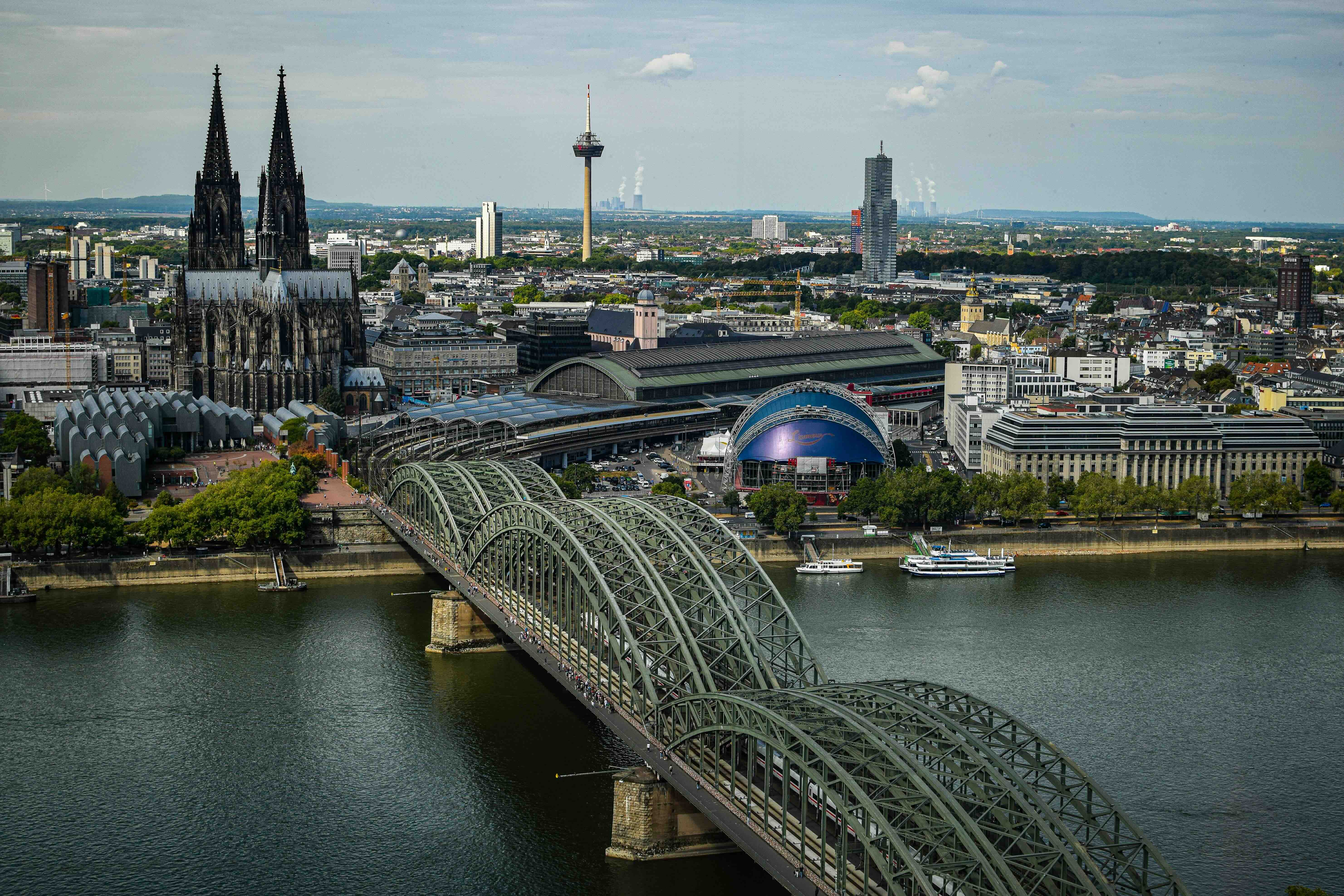 Cologne Cathedral and the Hohenzollern Bridge over the Rhine beside Köln Hauptbahnhof