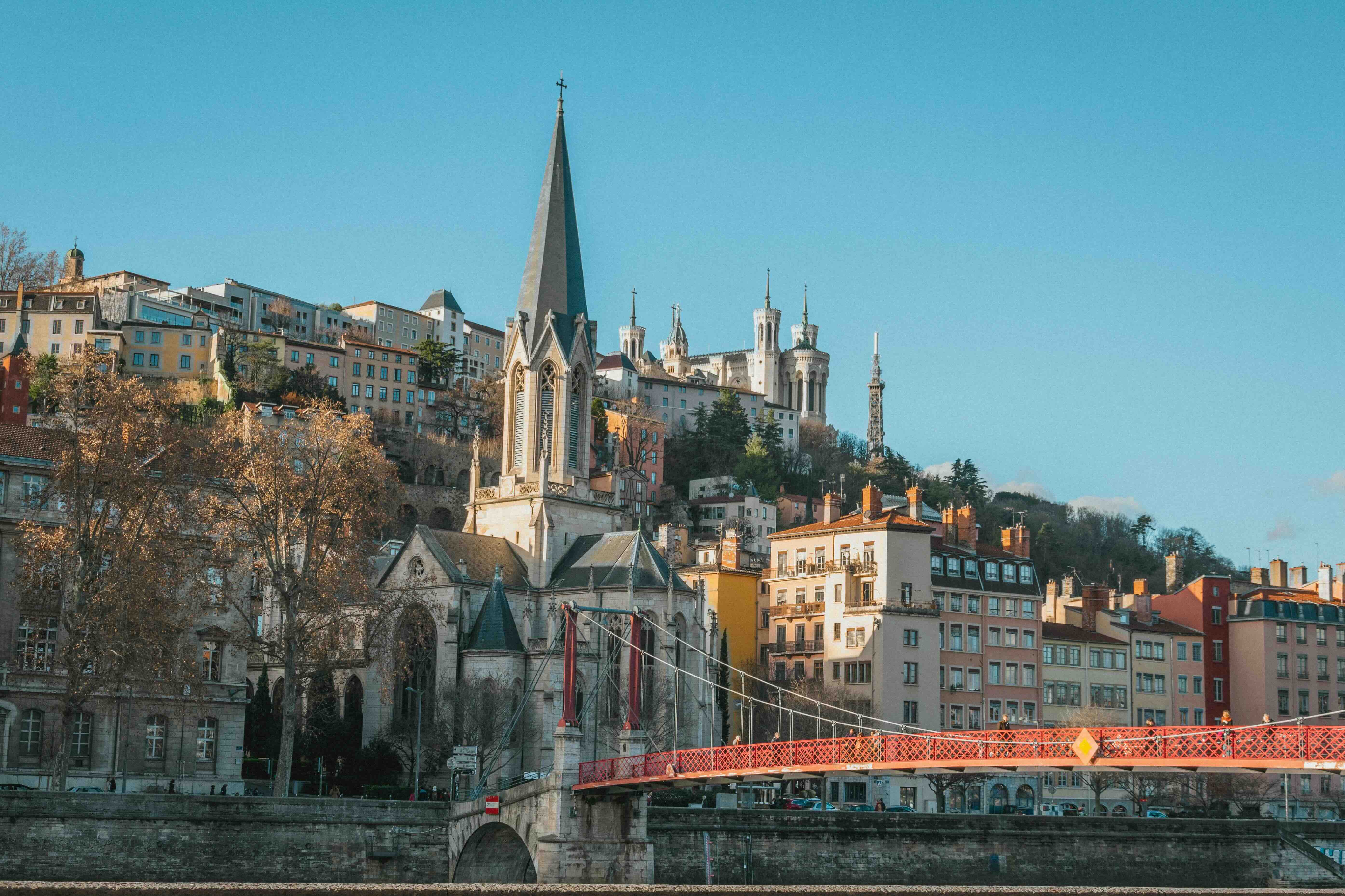 The Saône riverfront of Vieux Lyon with the Passerelle Saint-Georges and Fourvière basilica above