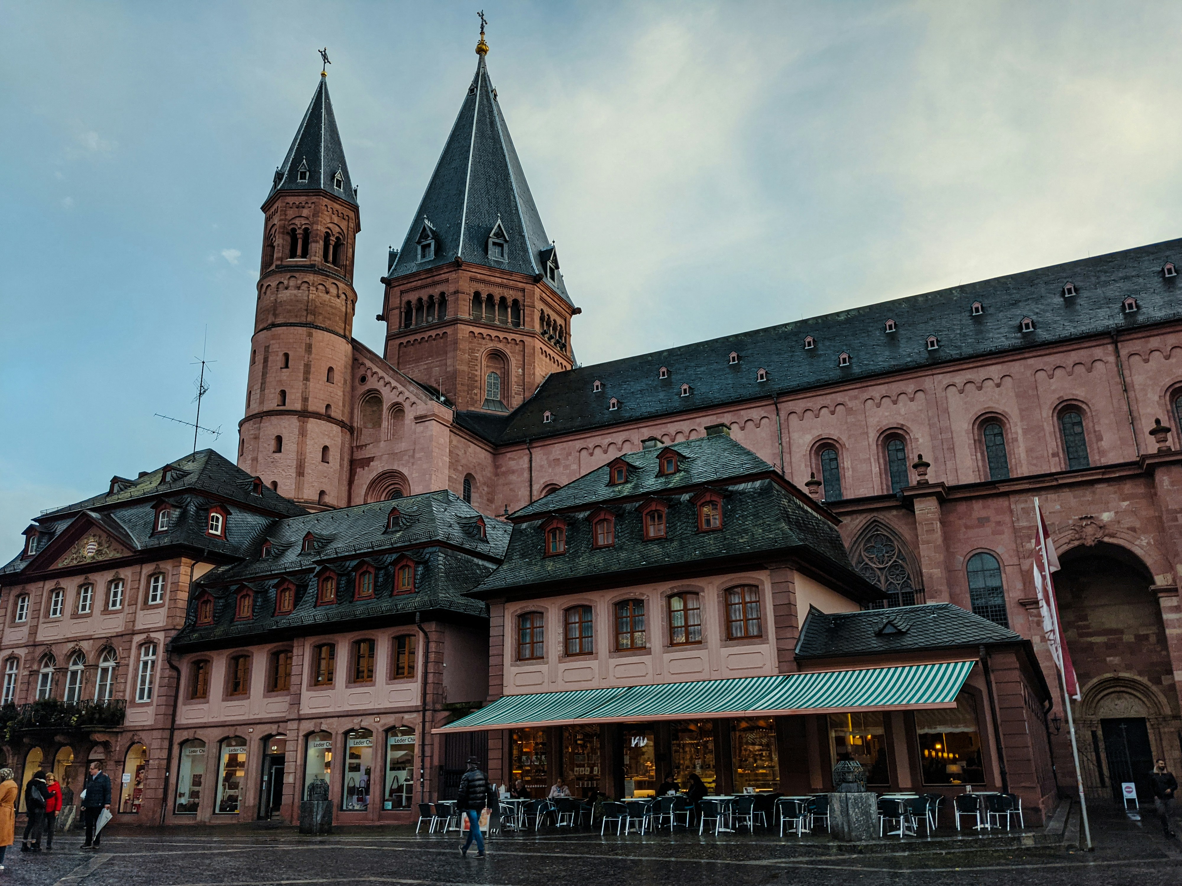 Regional train running along the Rhine Valley past medieval castles and vineyard slopes in Germany