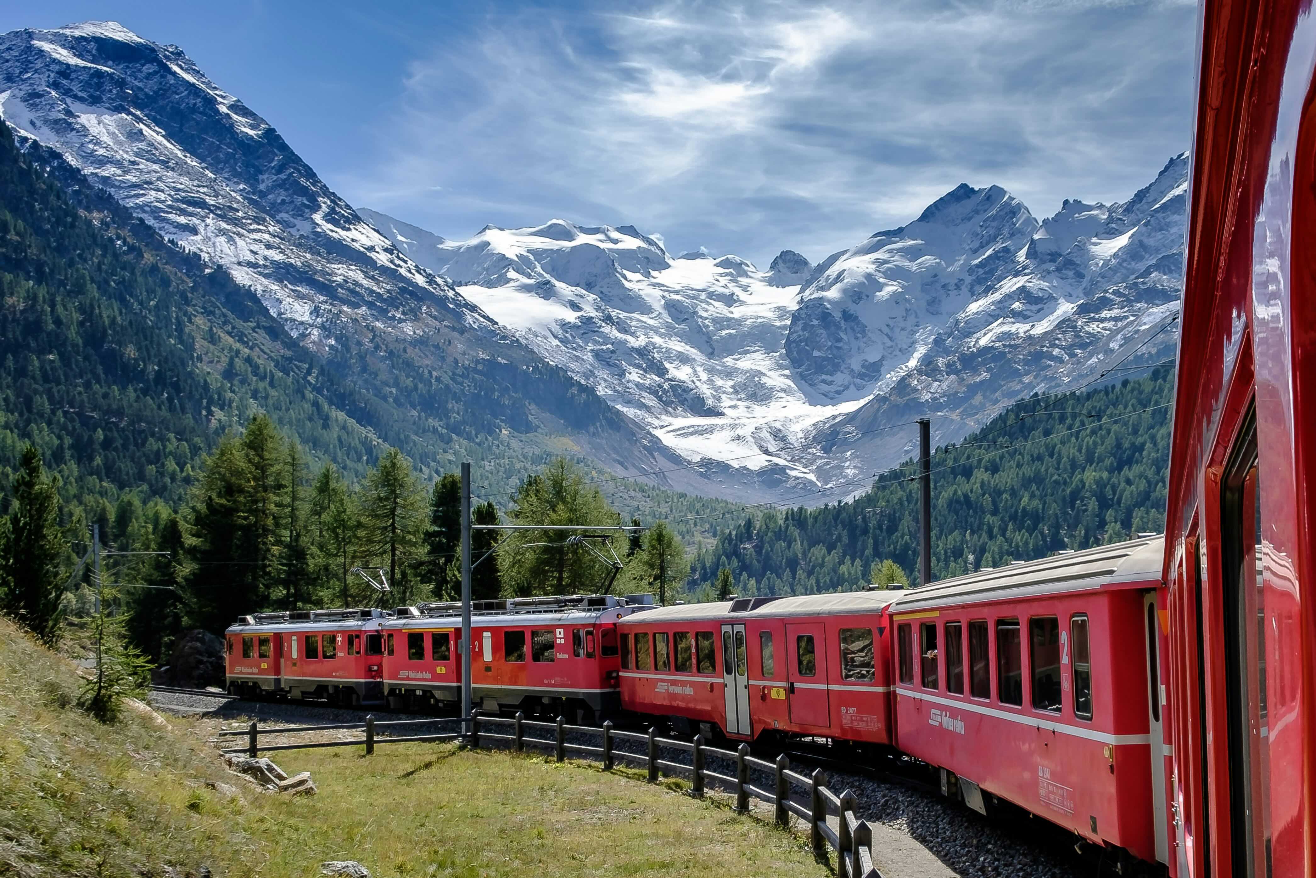 Bernina Express panoramic train crossing the high alpine pass between Switzerland and Italy