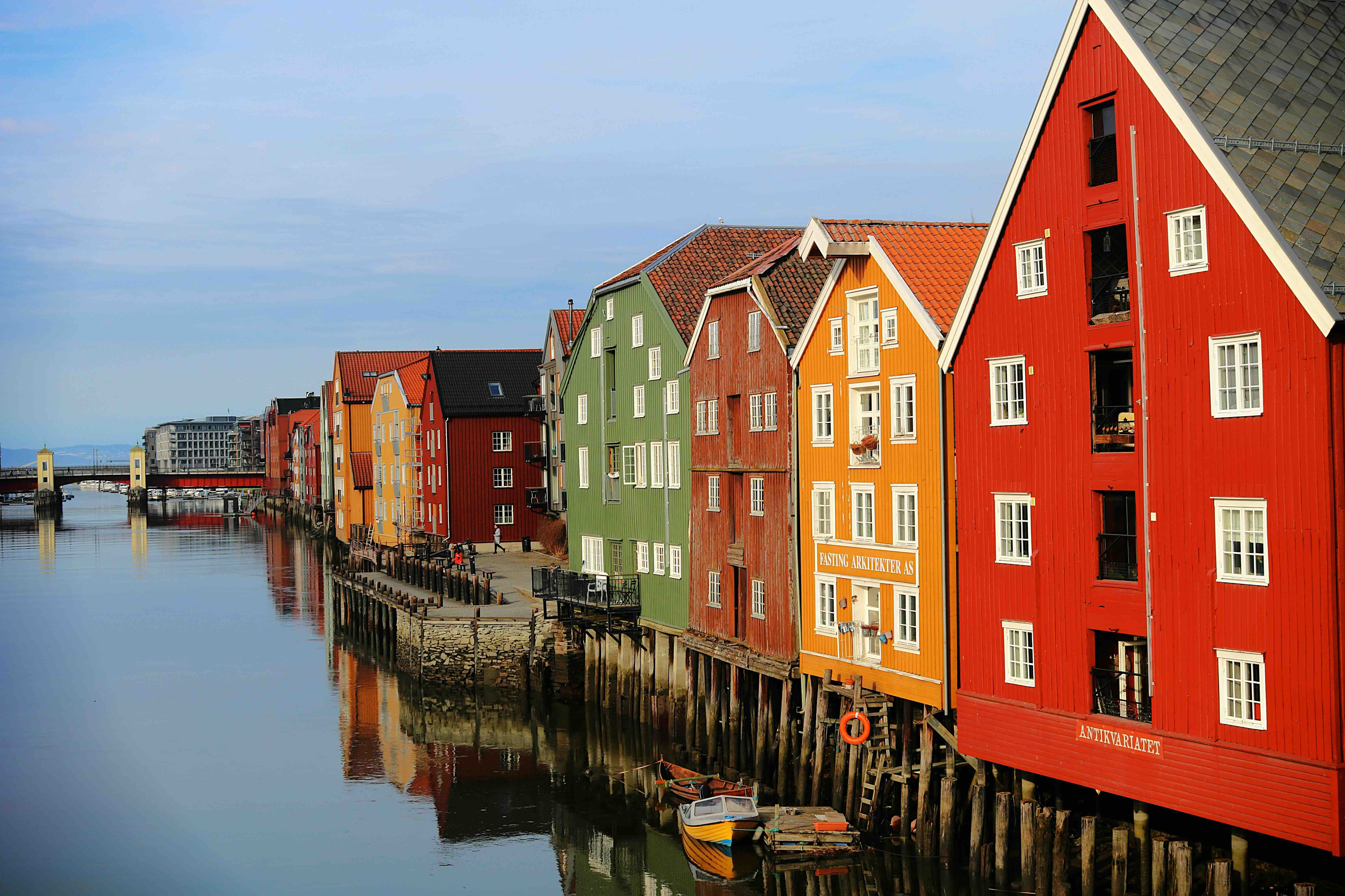 Colourful timber warehouses on stilts along the river Nidelva in Trondheim, arrival city of the Dovre Line from Oslo