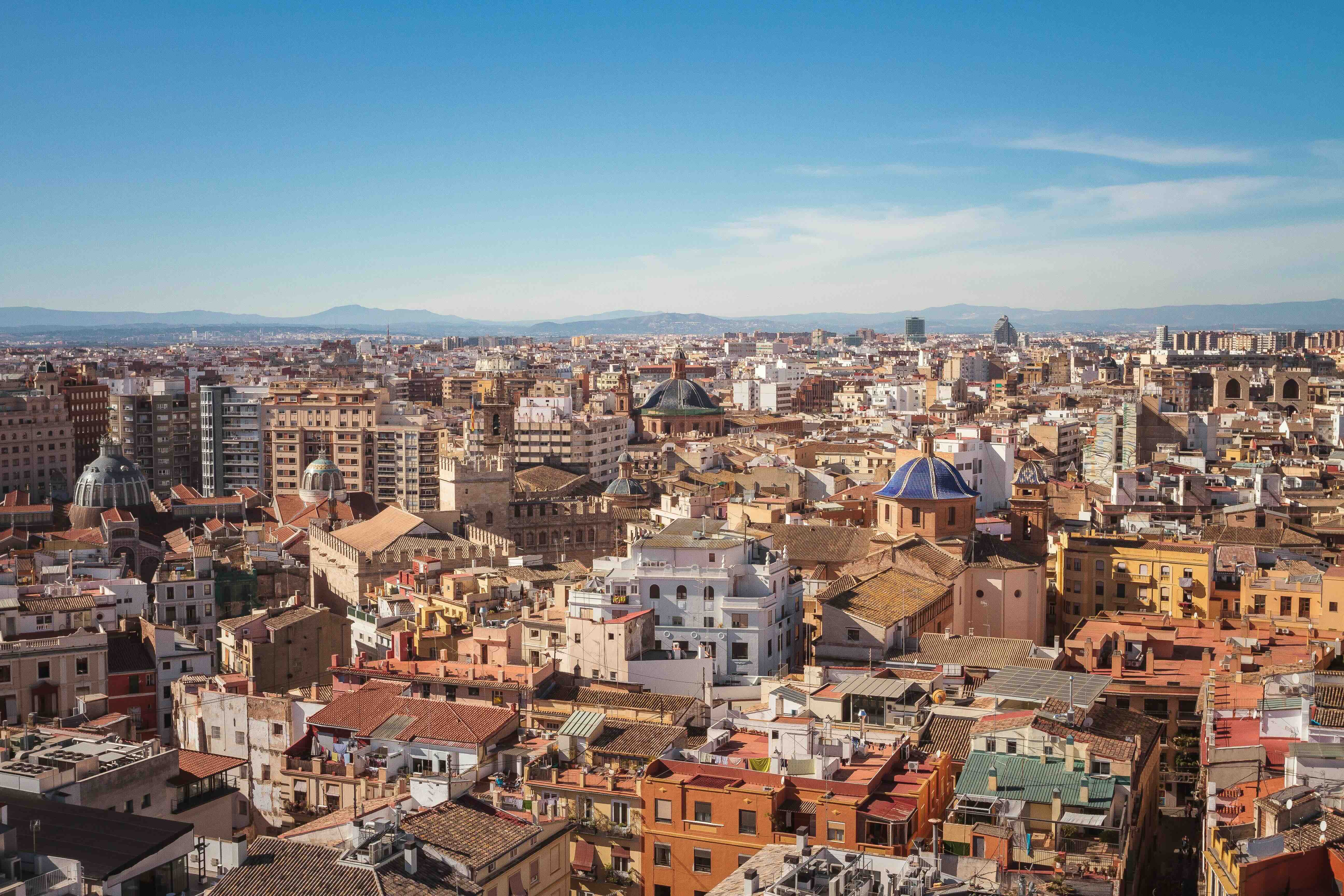 The rooftops and blue-tiled church domes of Valencia's old town, arrival city of the AVE from Madrid