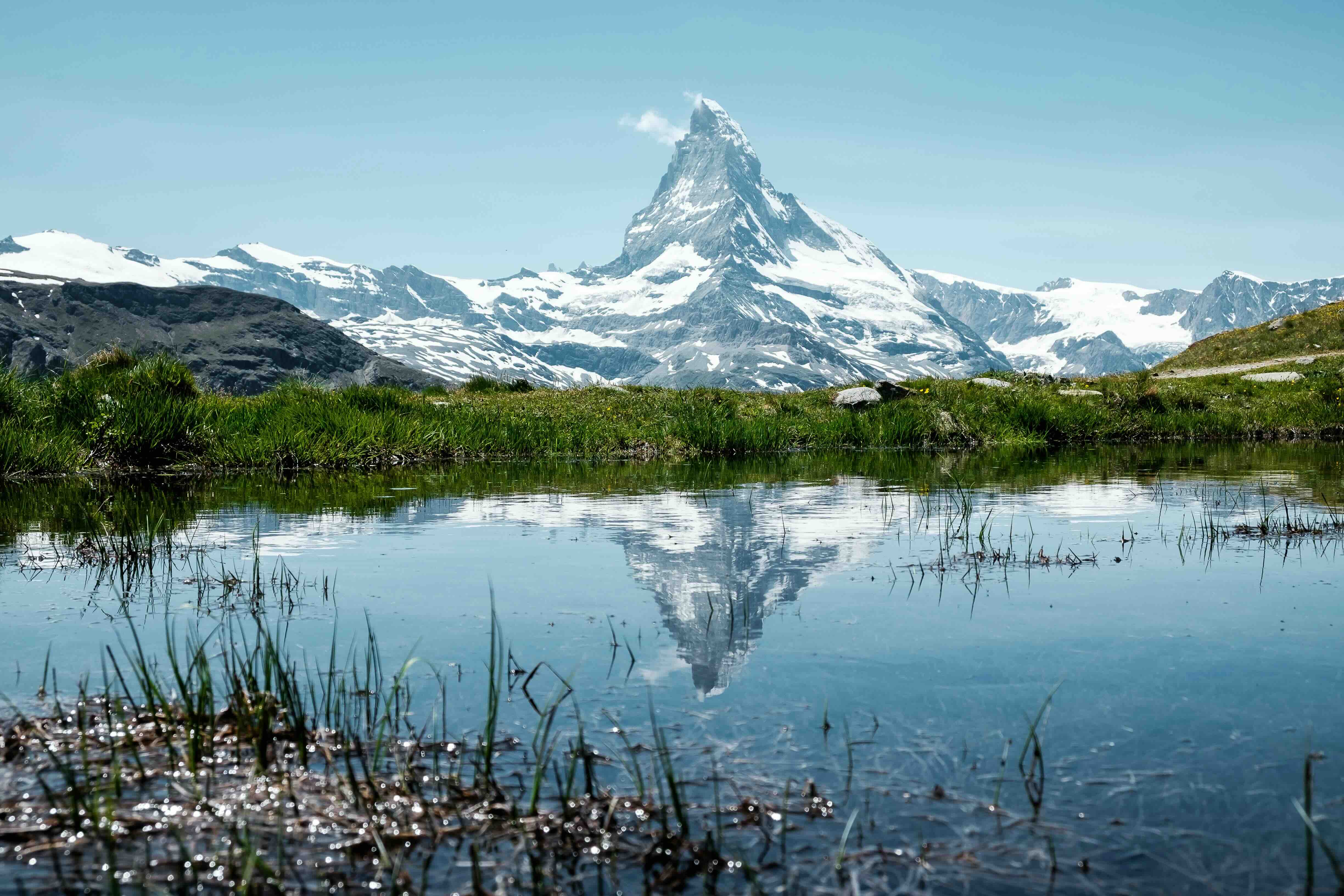 The Matterhorn reflected in a still alpine lake above Zermatt